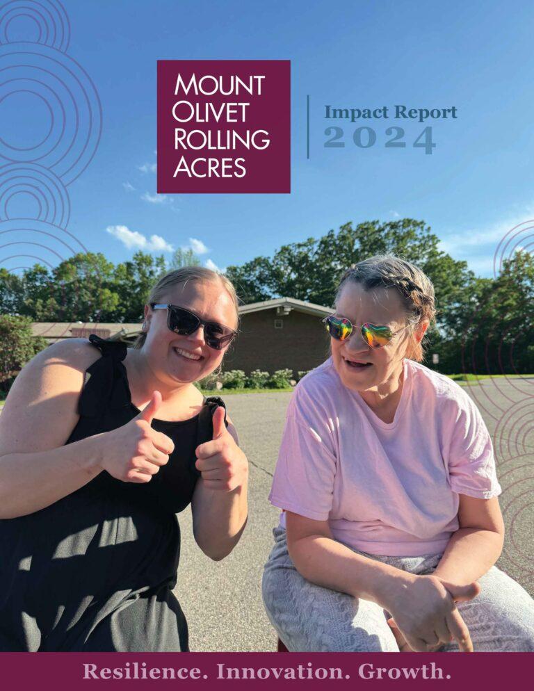 Two people smile and pose outdoors on a sunny day beside Mount Olivet Rolling Acres branding and a 2024 Impact Report label.
