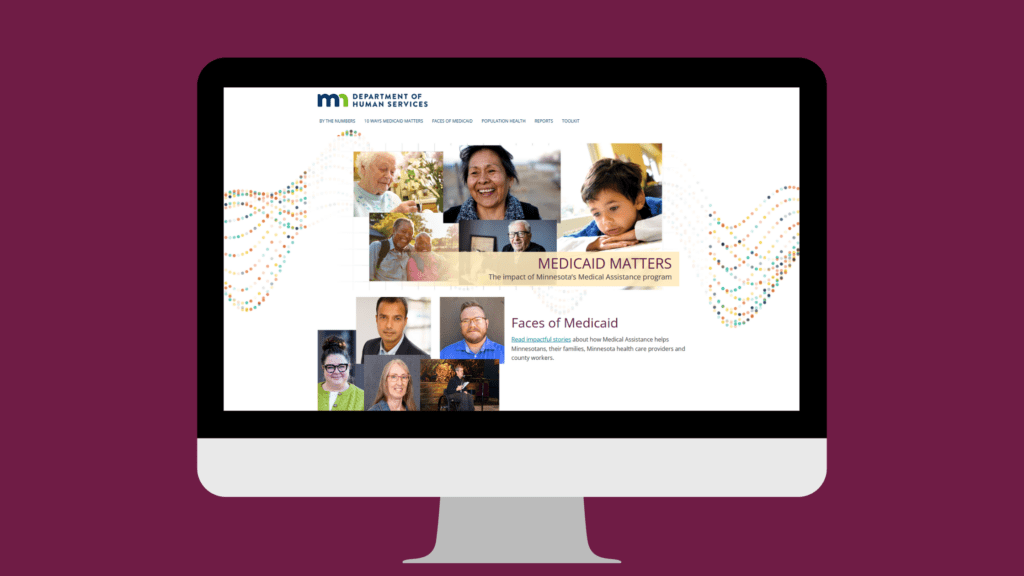 Desktop computer monitor displaying a webpage featuring a collage of diverse people.