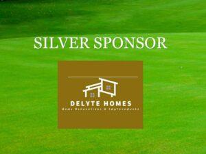 Green lawn background with a brown sponsor badge featuring a white line-drawing of a house and the text "Silver Sponsor."